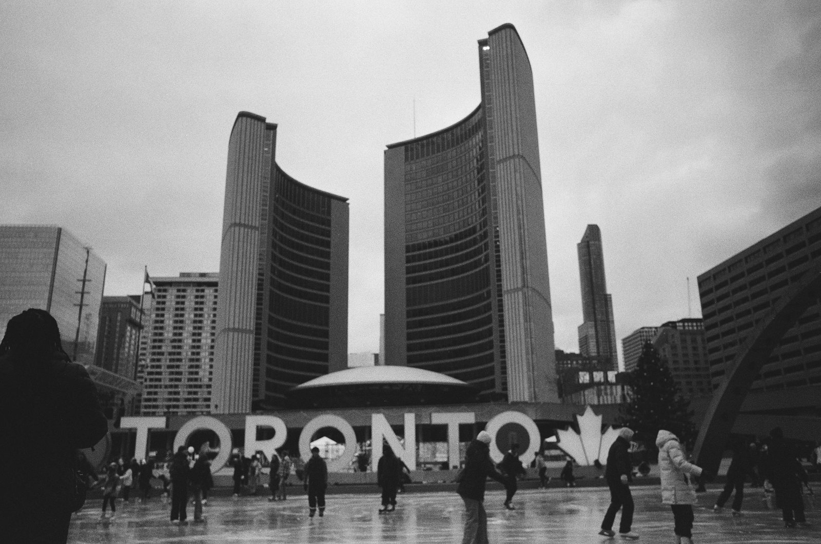 Toronto City Hall behind the Toronto sign