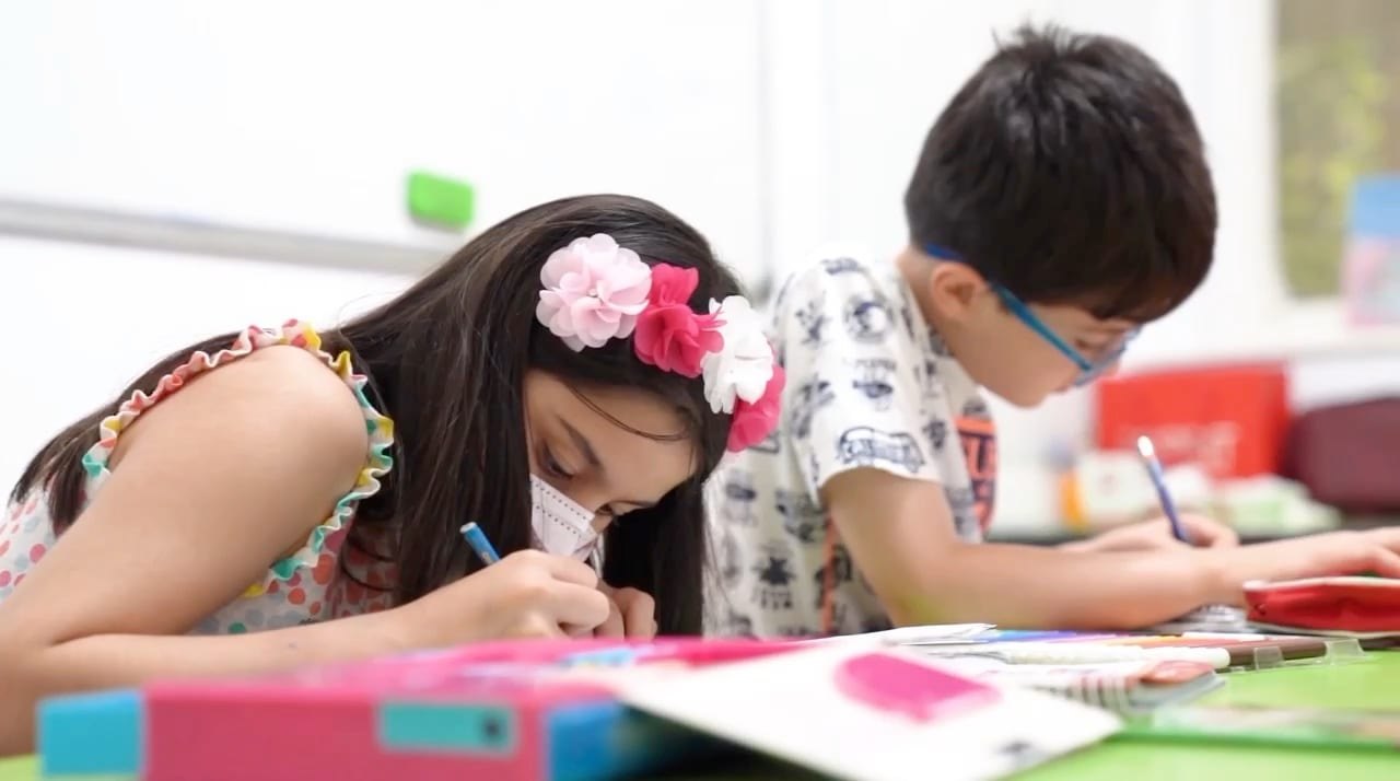 Children learning at Orange Institute